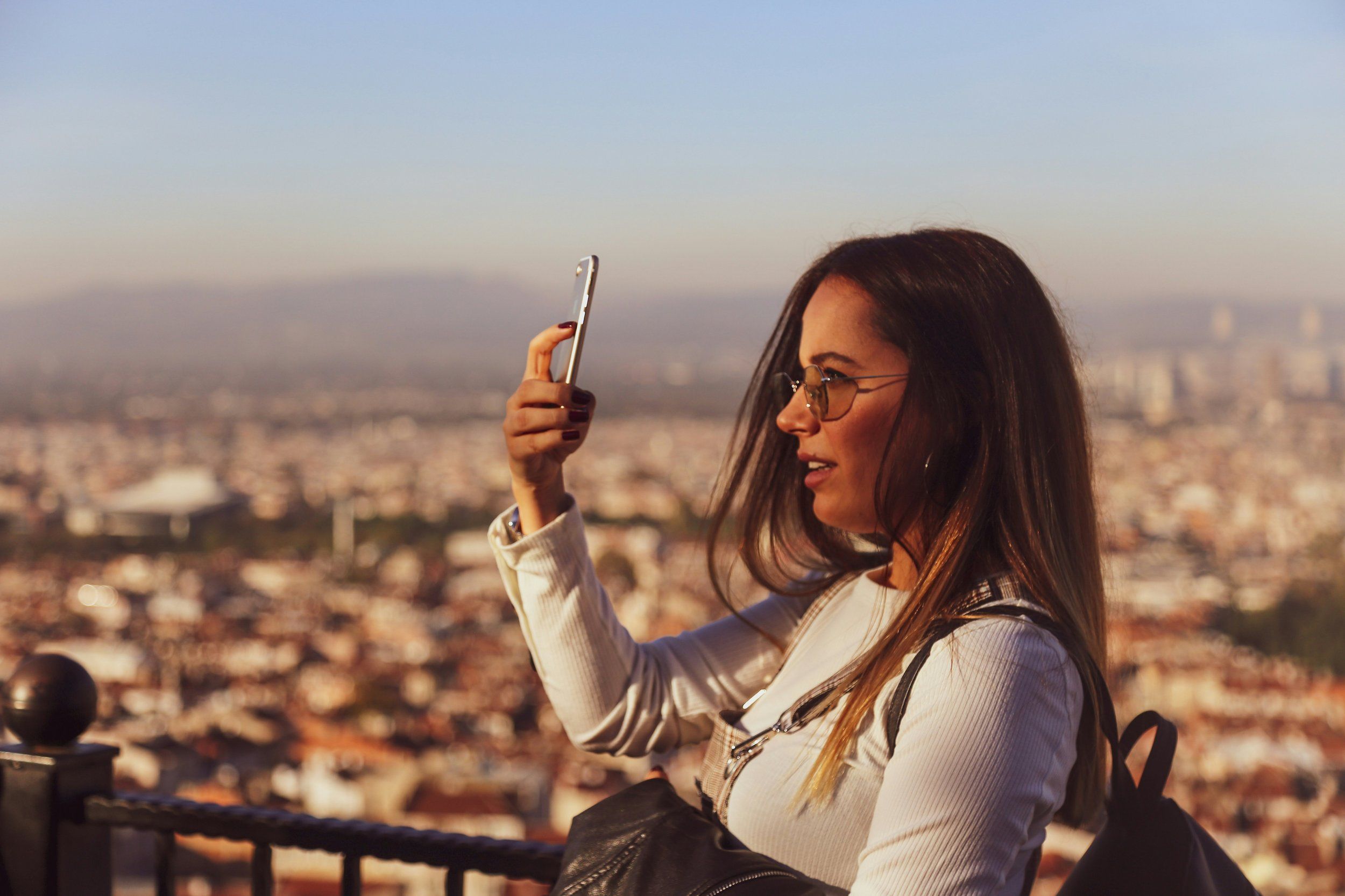 Traveller using a smartphone with mobile data while exploring a destination abroad
